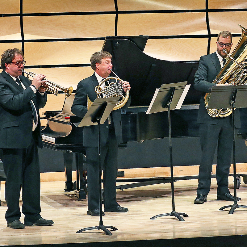 Brass players performing a fanfare at the Music Building grand opening celebration