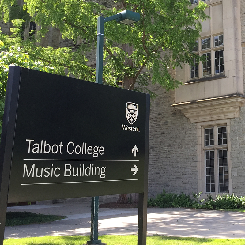 Exterior view of Talbot College with signage