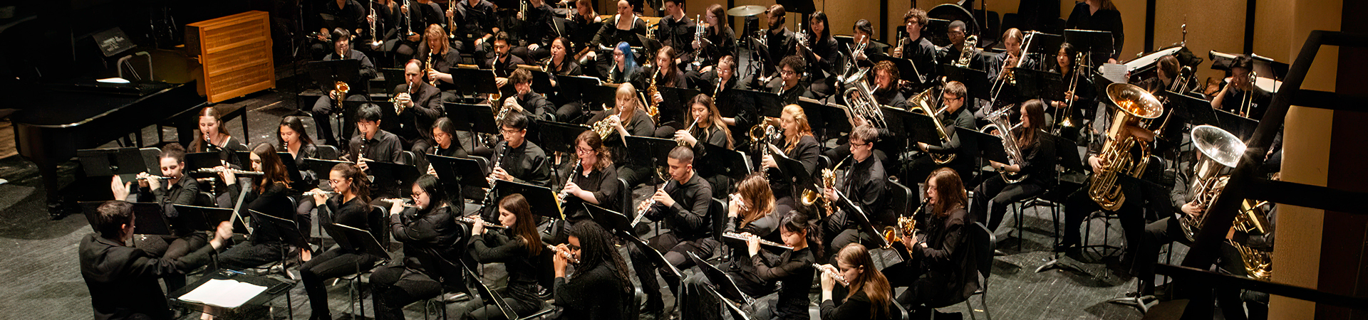 Symphonic Band student members performing on stage