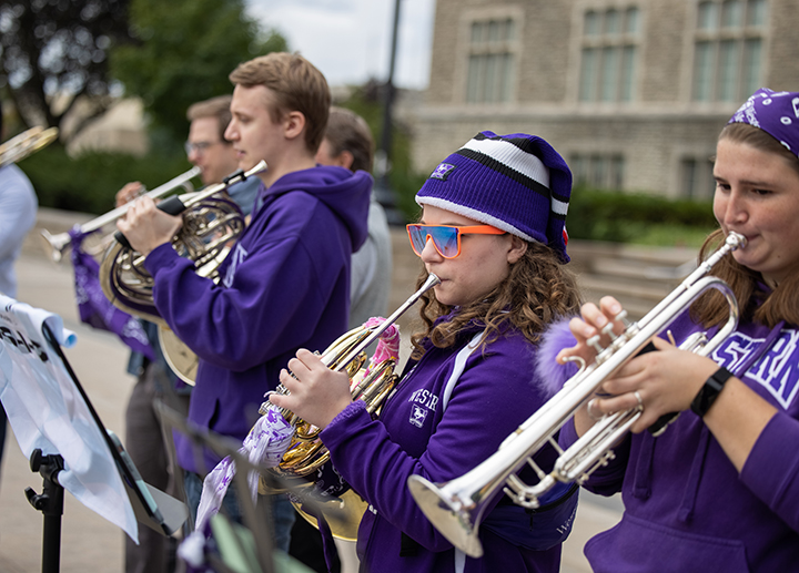 Brass students performing outside during Homecoming celebrations