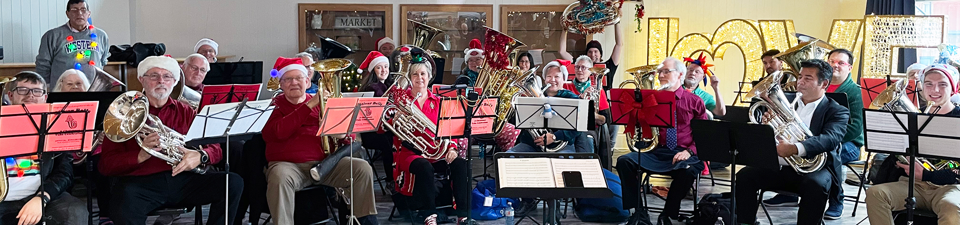 Tuba and Euphonium community players celebrating the holiday season with music at Covent Garden Market