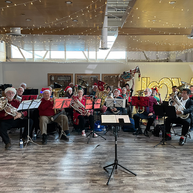 Tuba and Euphonium community players celebrating the holiday season with music at Covent Garden Market