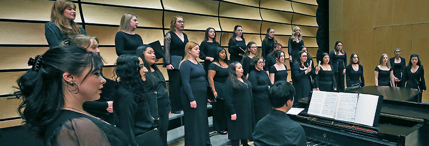 Les Choristes student choir members on stage