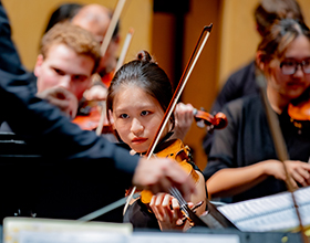 String student performing during Symphony Orchestra concert
