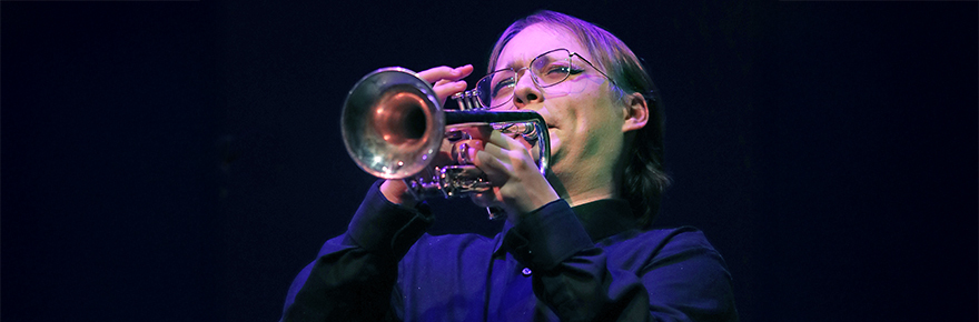 Student trumpet player Mike Meilleur performing during Jazz Ensemble concert