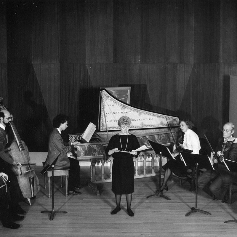 A black and while photo of an early music ensemble performing in 1983