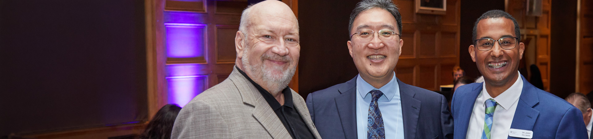 2024 Alumni Wall of Fame inductees Brian McIntosh (left) and Jamie Hillman (right) with Dean Michael Kim (centre) at the Alumni Award Celebration dinner during Homecoming 2024.