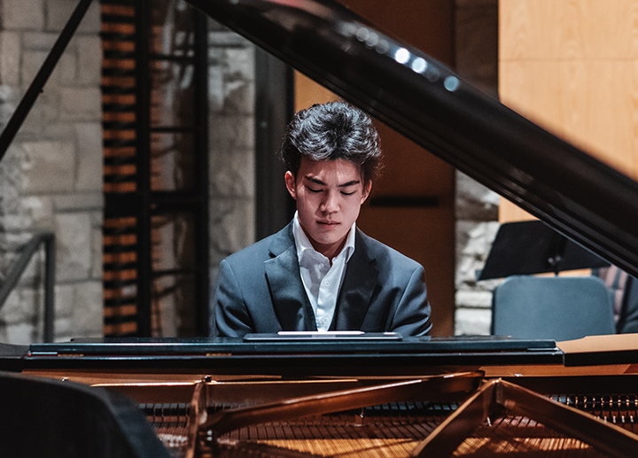 Grad student playing piano