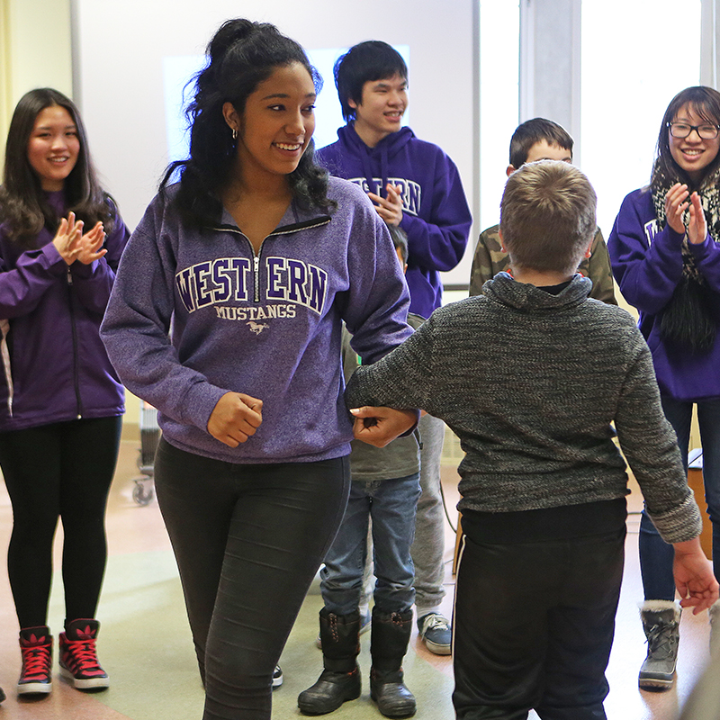 Music Education students with children learning music