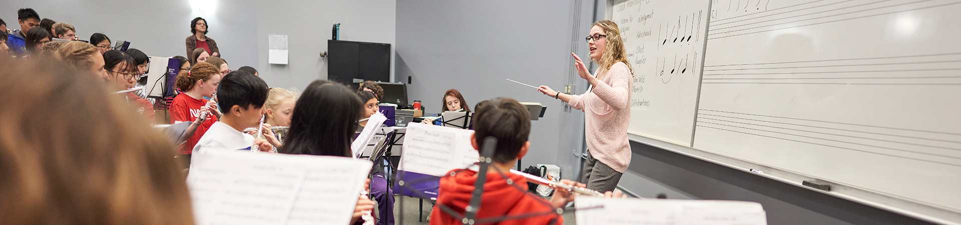 Student conductor leading Young Winds