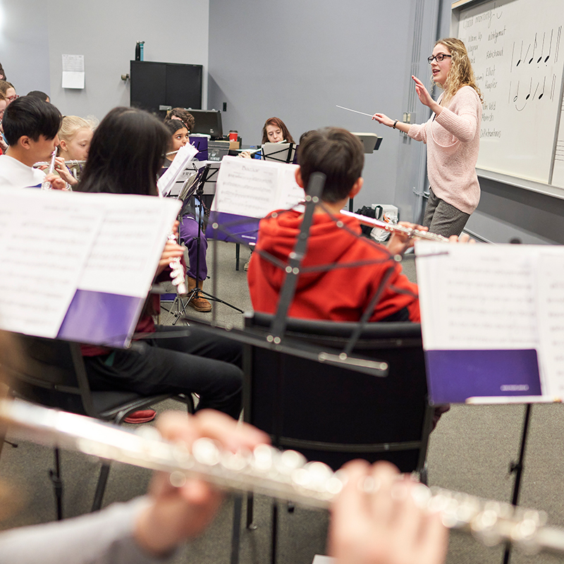Student conducting a youth band program