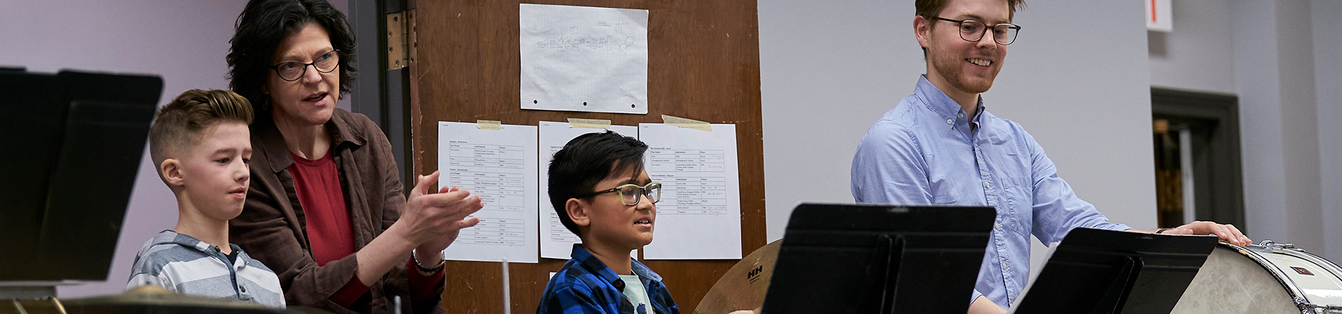 Music Education faculty and students working with children in a youth band program