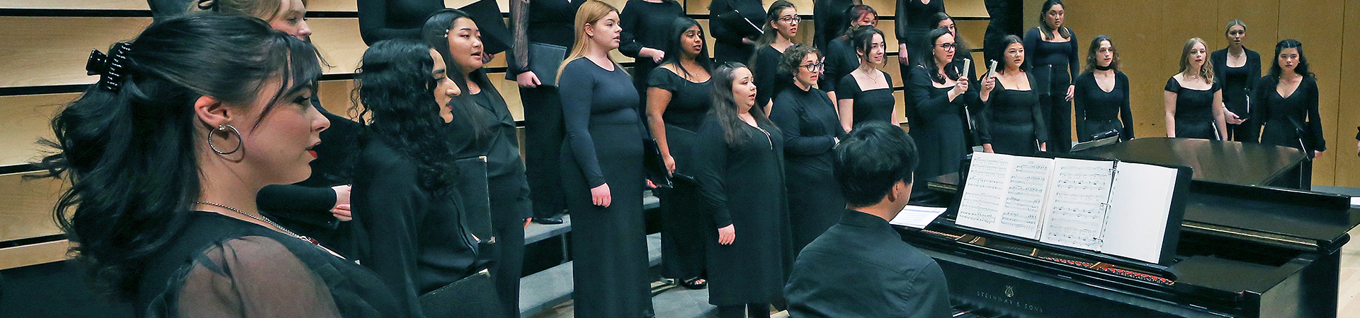 Choir members singing in performance