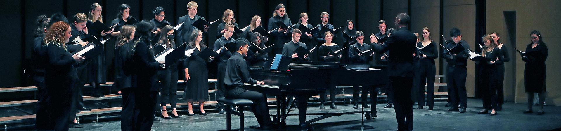 Choir members singing in performance