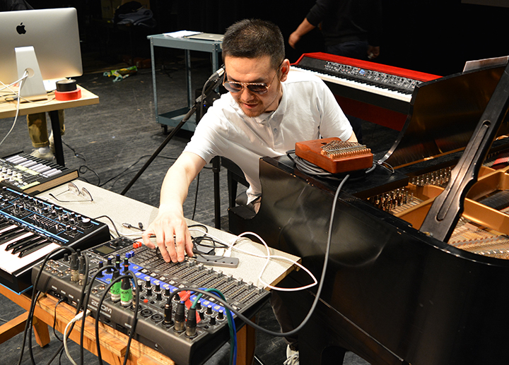 Music composition student setting up for a concert