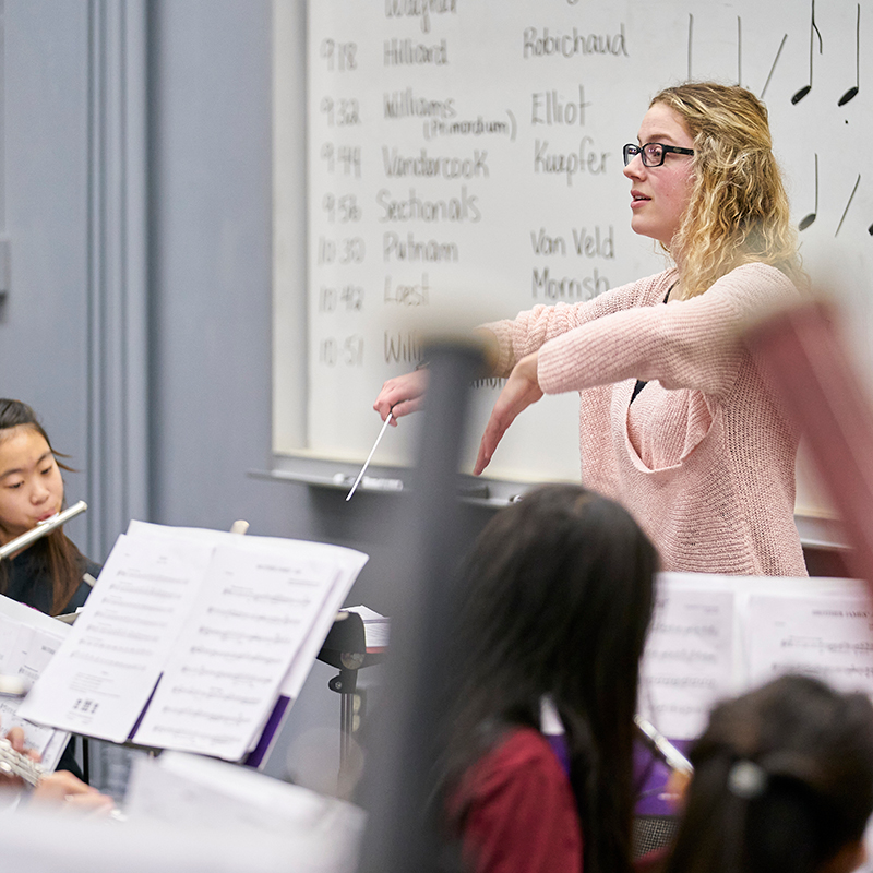 Music educator leading a youth band