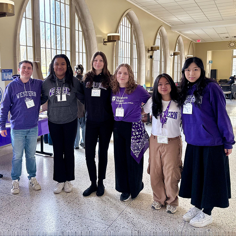 A row of friendly Music student volunteers