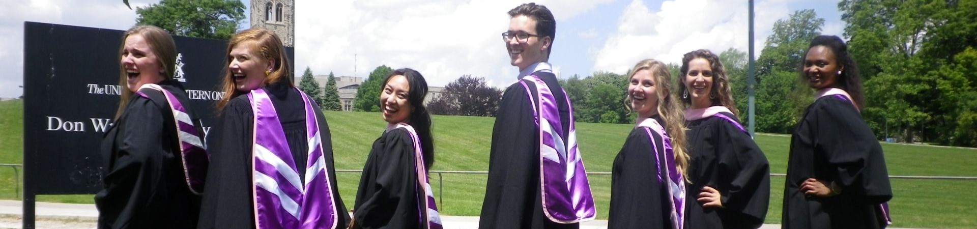 students with convocation regalia