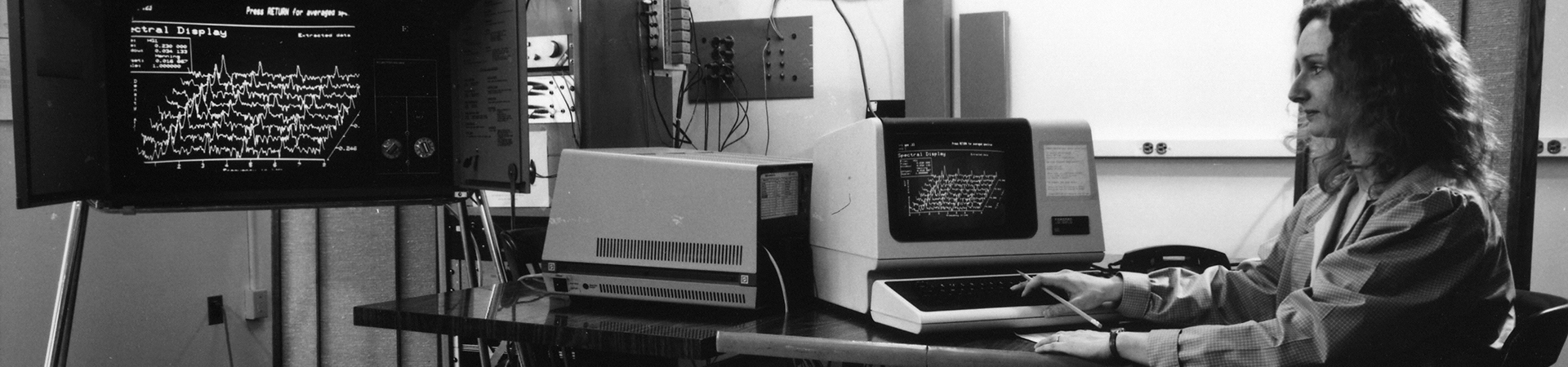 A student working on spectral analysis in a computer lab in the 1980s