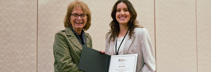 Photo: Denise Von Glahn, President of the Society for American Music and Professor of Musicology at Florida State University (left) presenting Postdoctoral Fellow Alyssa Cottle (right) with her award. (Credit: Michael Broyles/Society for American Music)