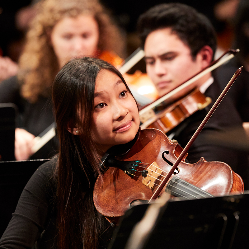 A student performing on viola in the Symphony Orchestra